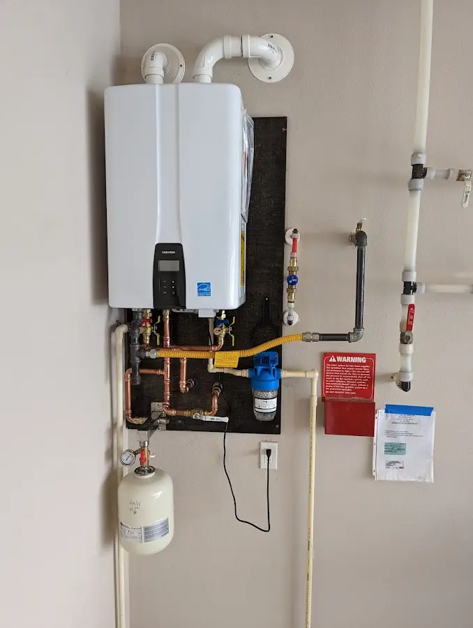 Professional plumber installing copper piping in a Rock Hill home